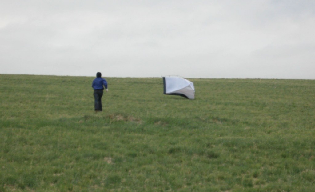 PHOTO: A researcher chases their tent across the steppe.