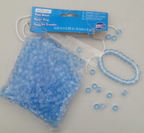 PHOTO: Package of 620 pony beads and a bracelet made from the beads