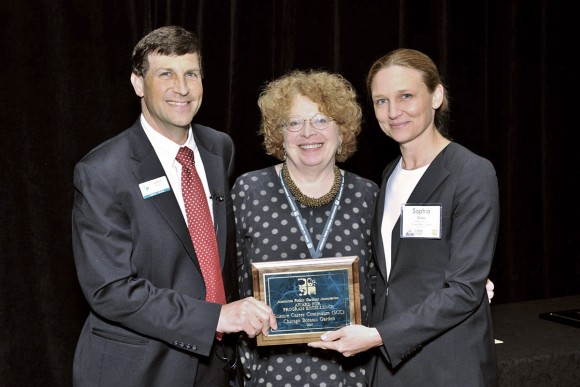 PHOTO: The Garden's emeritus Vice President of Community Education Programs Patsy Benveniste and CEO Sophia Shaw receive the award for Program Excellence from Dr. Casey Sclar, Executive Director of APGA.