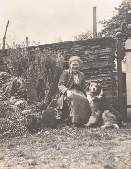 PHOTO: Beatrix Potter (Mrs. Heelis) by Charles King, April/May 1913, with her favourite collie Kep in the garden at Hill Top Farm and wearing her familiar Herdwick tweed skirt and jacket.