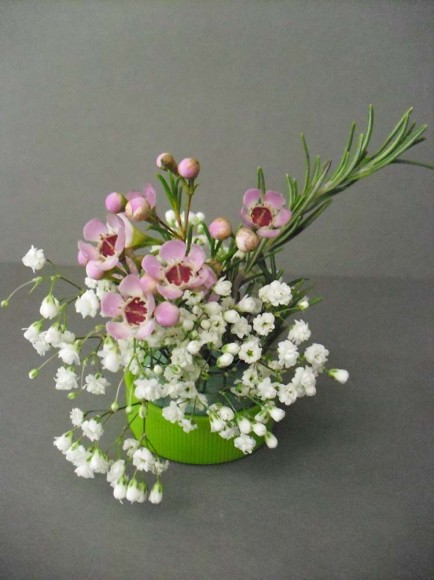 PHOTO: a tiny bouquet of waxflower, baby's breath, and rosemary.
