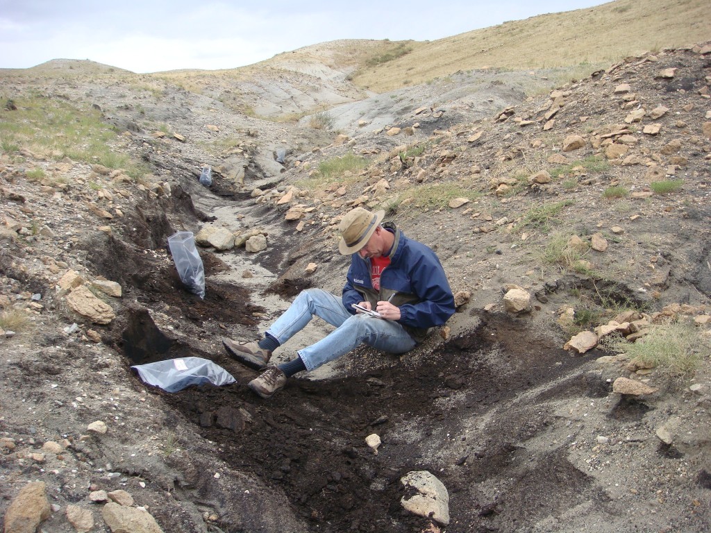 PHOTO: Dr. Herendeen collects lignite samples at Khuren Dukh, an unusual site with both plant and animal (dinosaur) fossils.