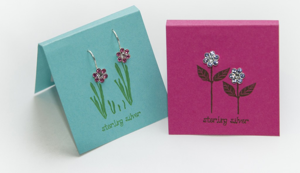 PHOTO: Delicate crystal and sterling silver children's earrings in the shape of 6-petal flowers.