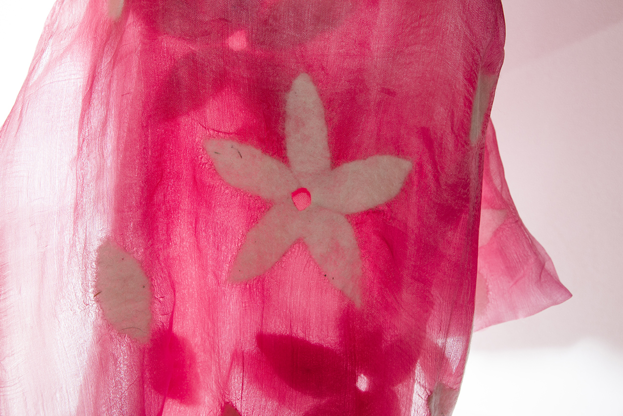 PHOTO: A gauzy, pink silk scarf with felted white 5-petal flowers.