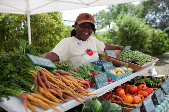 PHOTO: Green Youth Farm crew member Evon at the North Lawndale community farm stand.