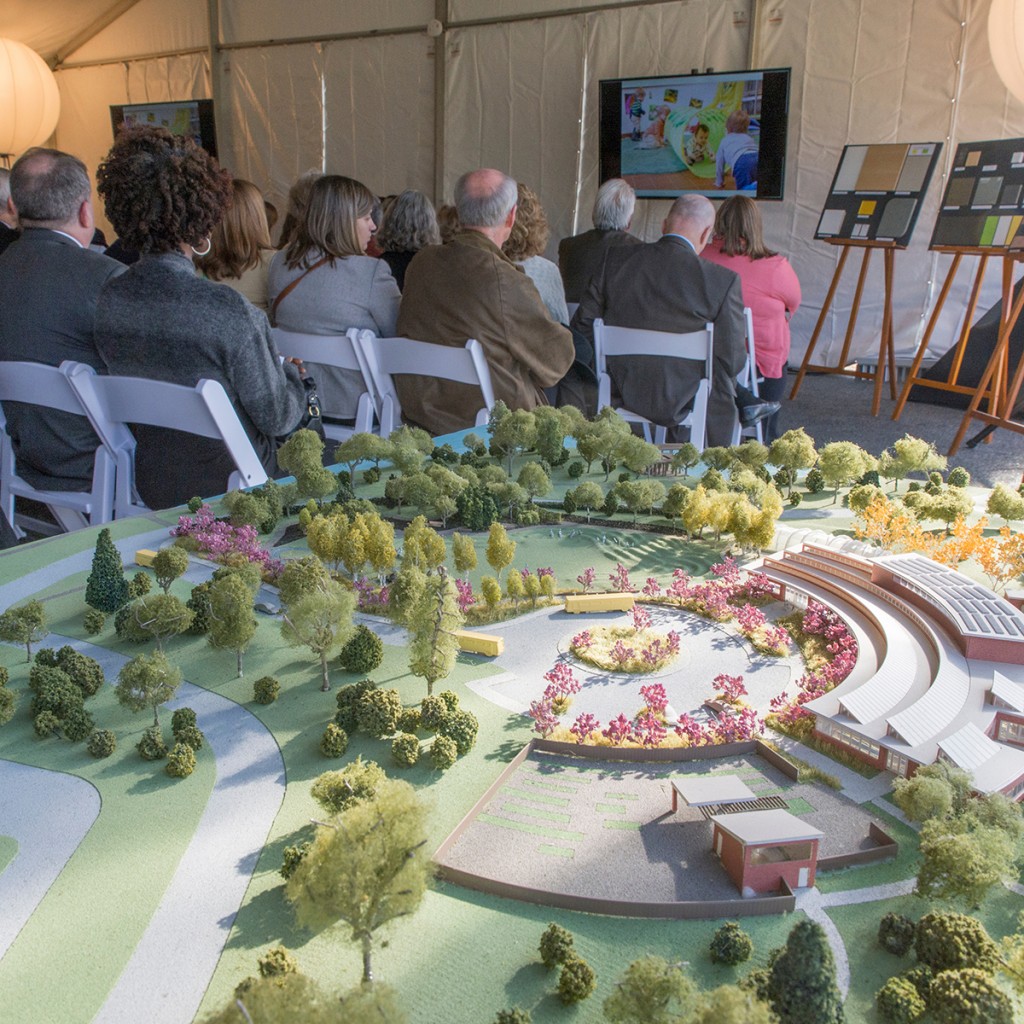 PHOTO: The groundbreaking ceremony; with model of the campus in the foreground.