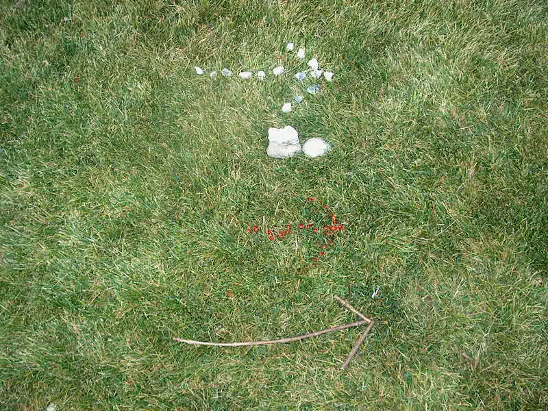 PHOTO: Pictured here are four diffent ways to make arrows using stones, sticks, and red berries.