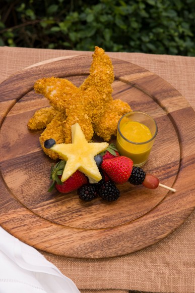 PHOTO: Cornflake-crusted chicken tenders with a skewer of fresh fruit.