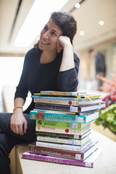 Librarian Leora Siegel with book stack