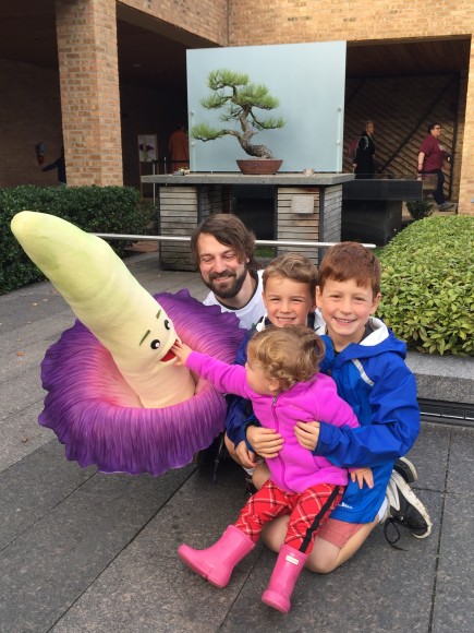 PHOTO: Taylor an Amorphophallus titanum puppet, poses with kids.