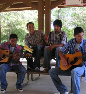 Jesus singing with fellow Green Youth Farm participants for a Talent show.