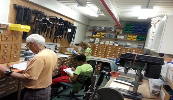 PHOTO: Volunteers Doris and Leon and intern Tremaine processing label requests.