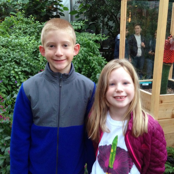 Kids visiting corpse flower bloom, wearing a corpse flower t-shirt.