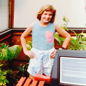 Heather in a greenhouse in California, age 7