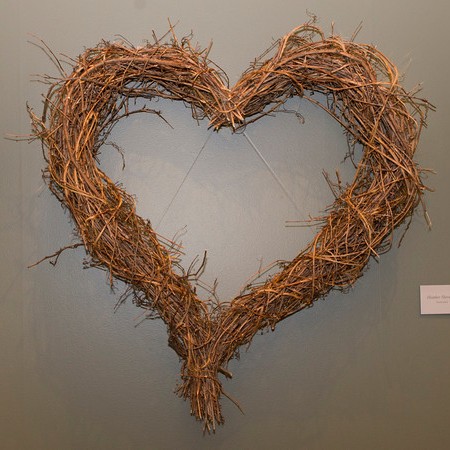 PHOTO: Large, heart-shaped wreath made from grape vines.