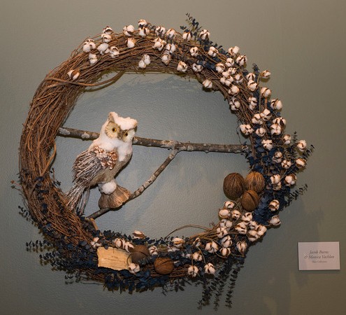 PHOTO: An owl made from natural materials perches in this cotton boll wreath.