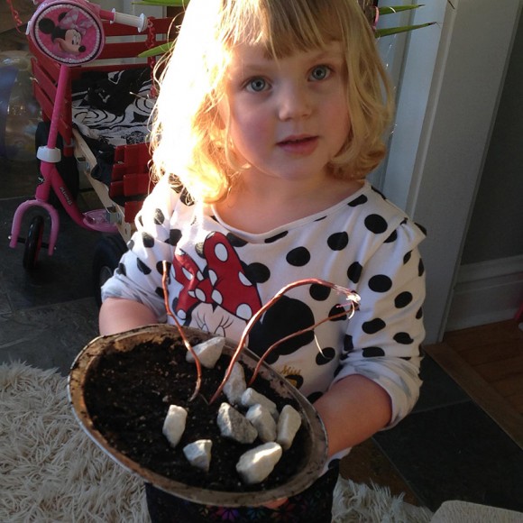 PHOTO: Laila holds her finished mudpie.