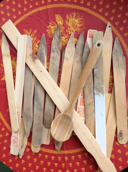 BEFORE:  Clean out the paint shelf! Old paint stirrers, stakes, and even wooden spoons can work as plant markers.